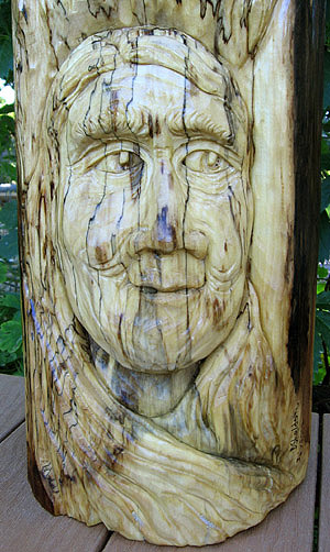 Aspen Carving Duo in the Garden - Detailed view