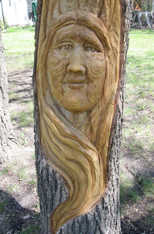 Elm Carving Duo in the Garden - Detailed View