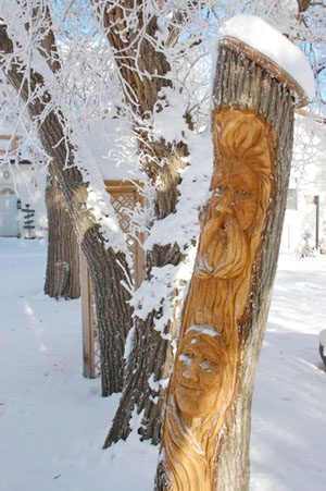 Elm Carving Duo in the Garden - Winter scene